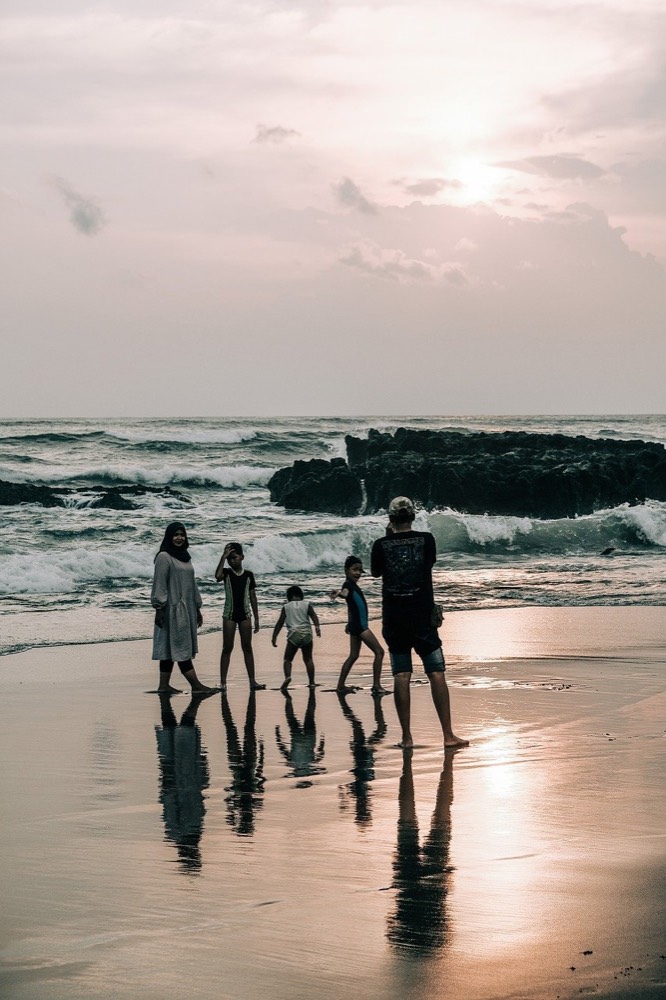 Family walking together on a beach